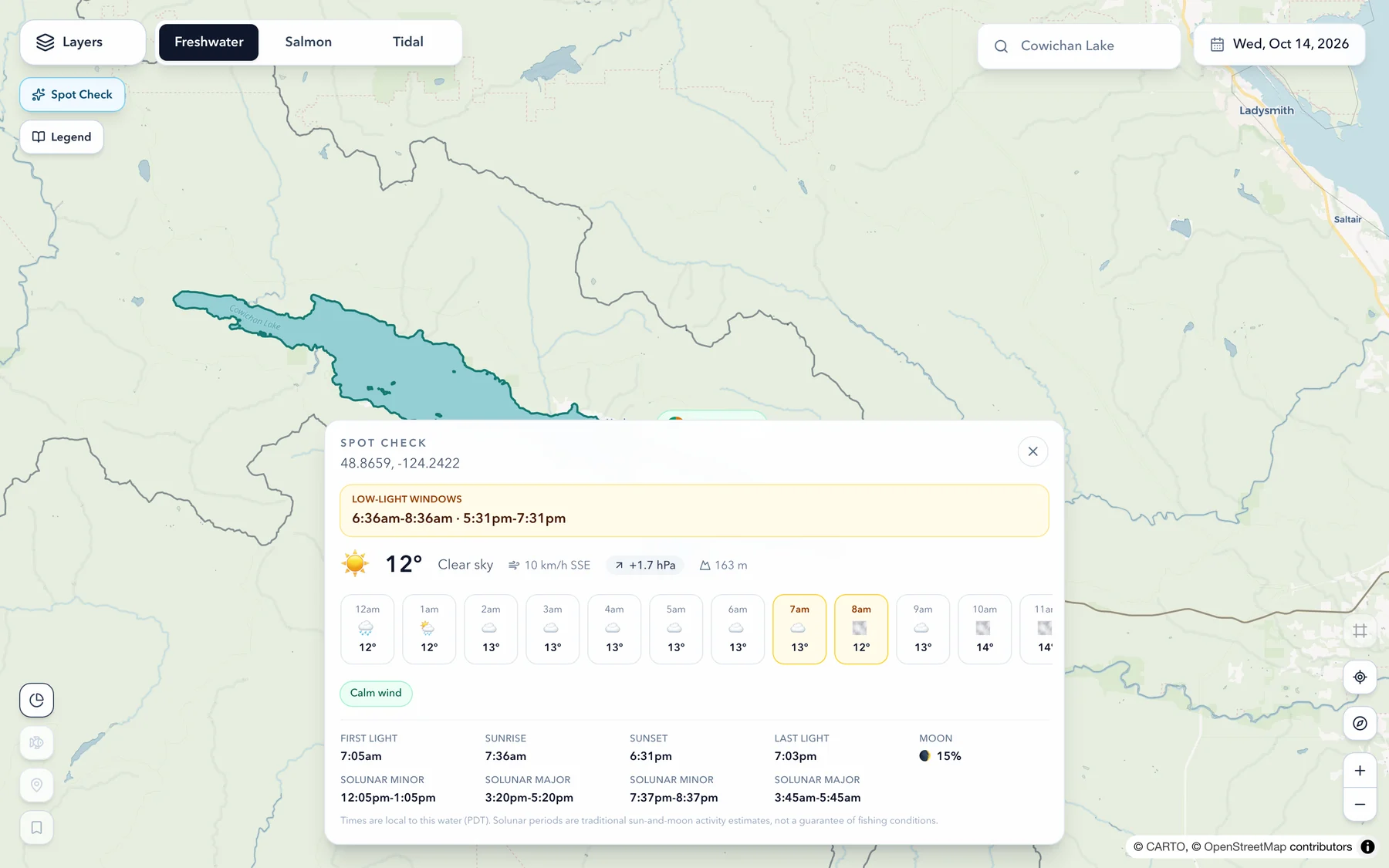 The Spot Check panel open over Cowichan Lake, headed by low-light windows of 6:36 to 8:36am and 5:31 to 7:31pm, then 12 degrees and clear with 10 km/h SSE wind, pressure up 1.7 hPa and 163 m elevation, an hourly strip with the low-light hours picked out, and first light, sunrise, sunset, moon and solunar periods below.